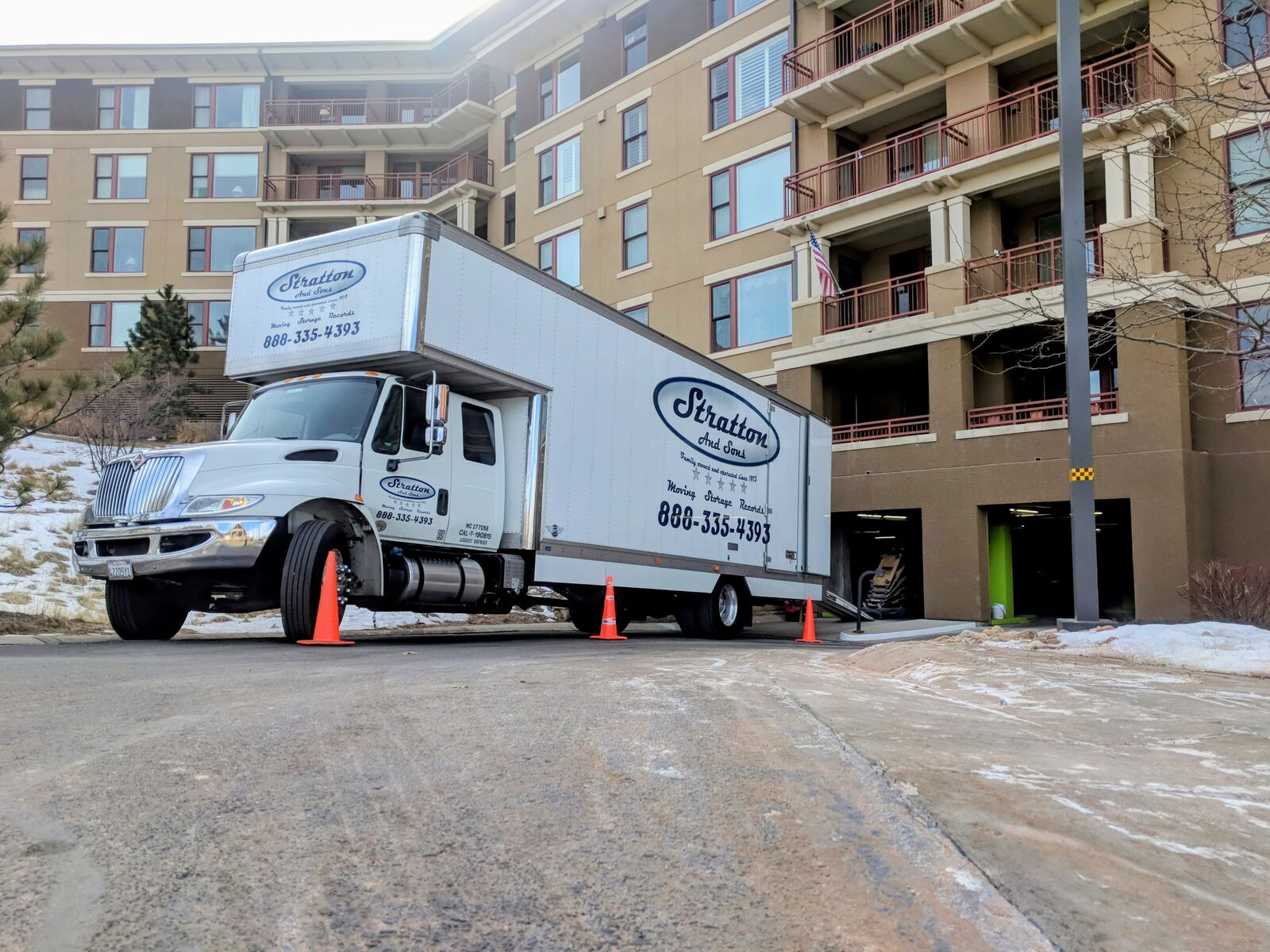 Stratton and Sons branded moving trucks on a long-distance interstate job